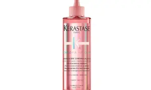 Kérastase Chroma Absolu Soin Acide Chroma Gloss, en rosa flaska med en applikator, ger ditt hår fantastisk glans.