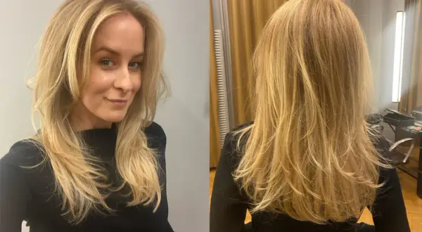 En kvinna med blont hår som har fått fantastiskt volym i håret. Från sidan och bakifrån.