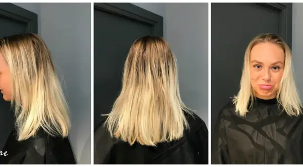 Tunt hår med gardinlugg, blont och lite ostylat. Hon ser lite skeptisk ut.