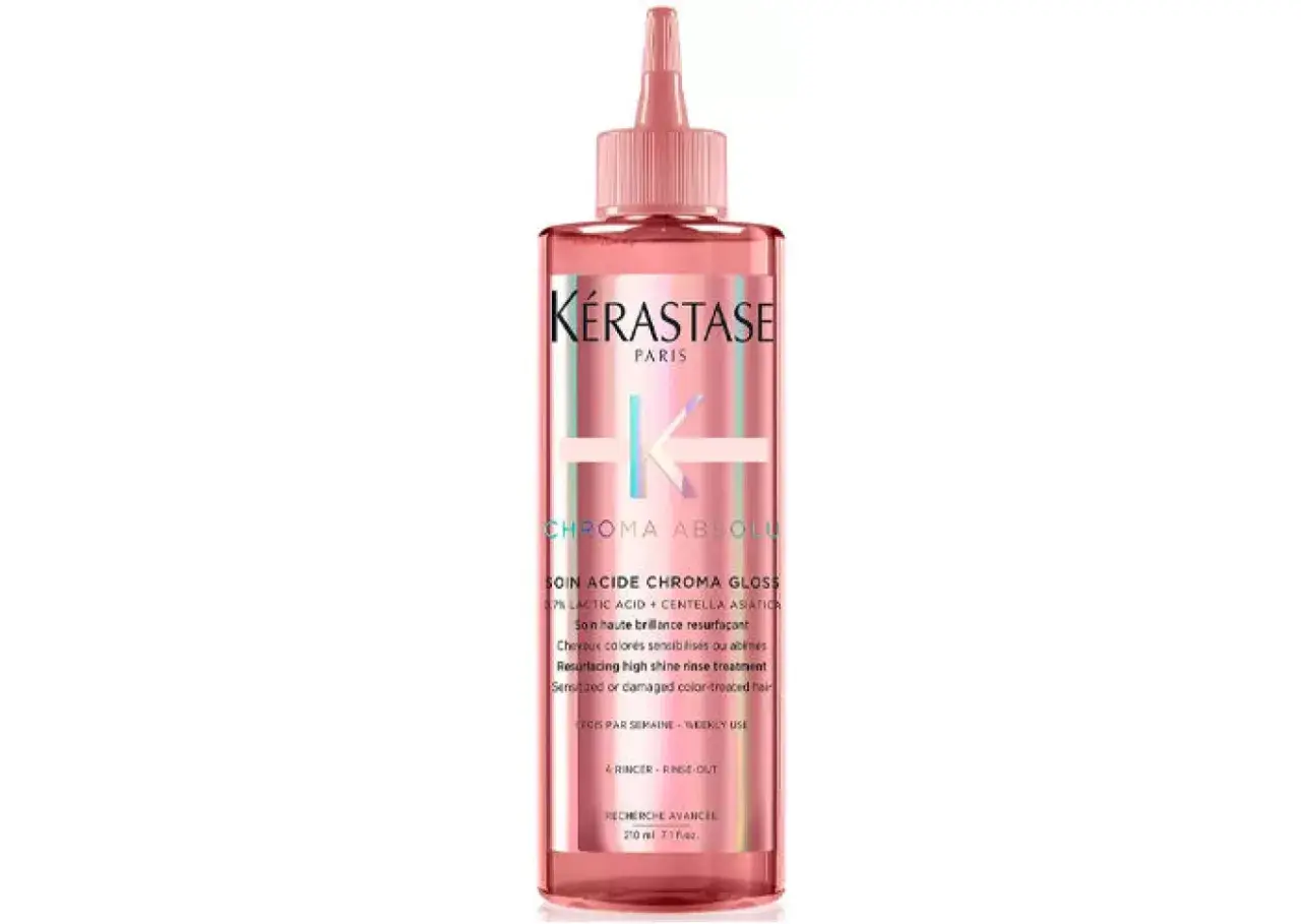 Kérastase Chroma Absolu Soin Acide Chroma Gloss, en rosa flaska med en applikator, ger ditt hår fantastisk glans.