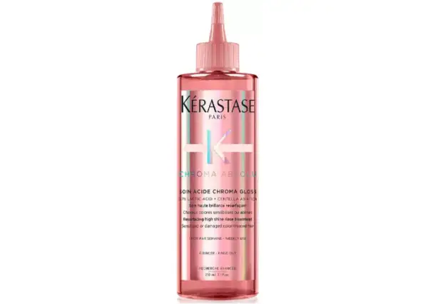 Kérastase Chroma Absolu Soin Acide Chroma Gloss, en rosa flaska med en applikator, ger ditt hår fantastisk glans.